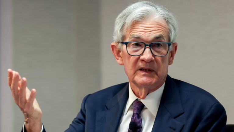 Powell sees tariffs raising inflation and says Fed will wait before further