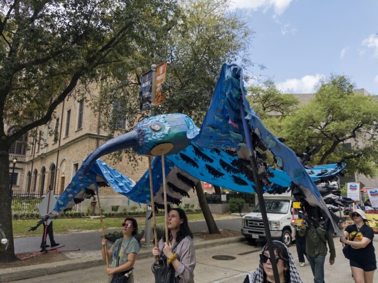 Protestors march in downtown Houston to oppose CERAWeek on first day of