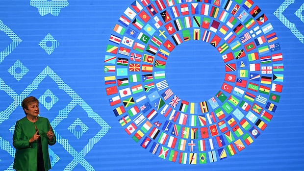 IMF warns of risks from AI boom and debt, but raises forecast for world